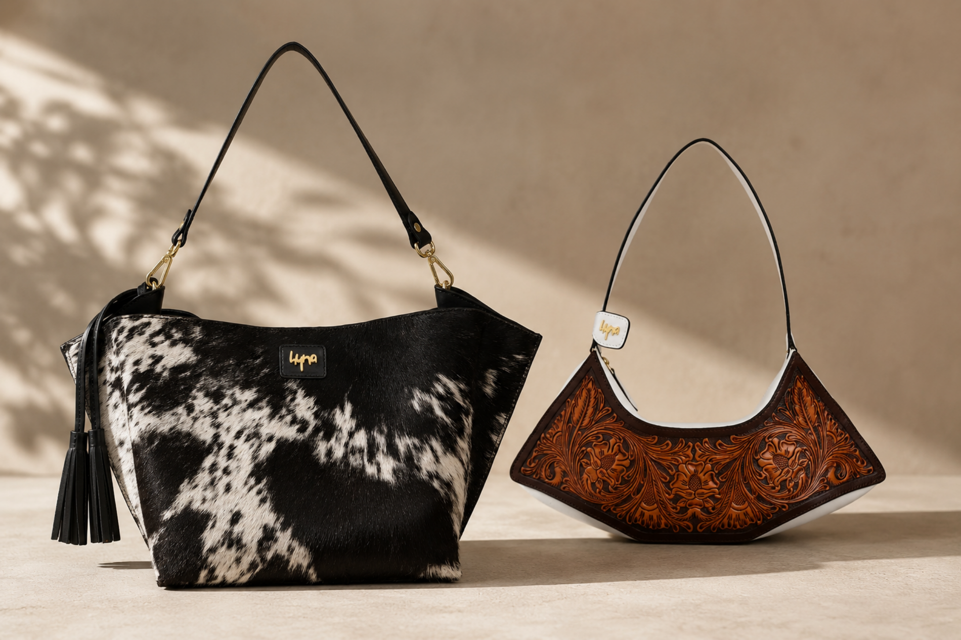 Hyna natural cowhide bag and hand-tooled leather bag shown side by side for comparison