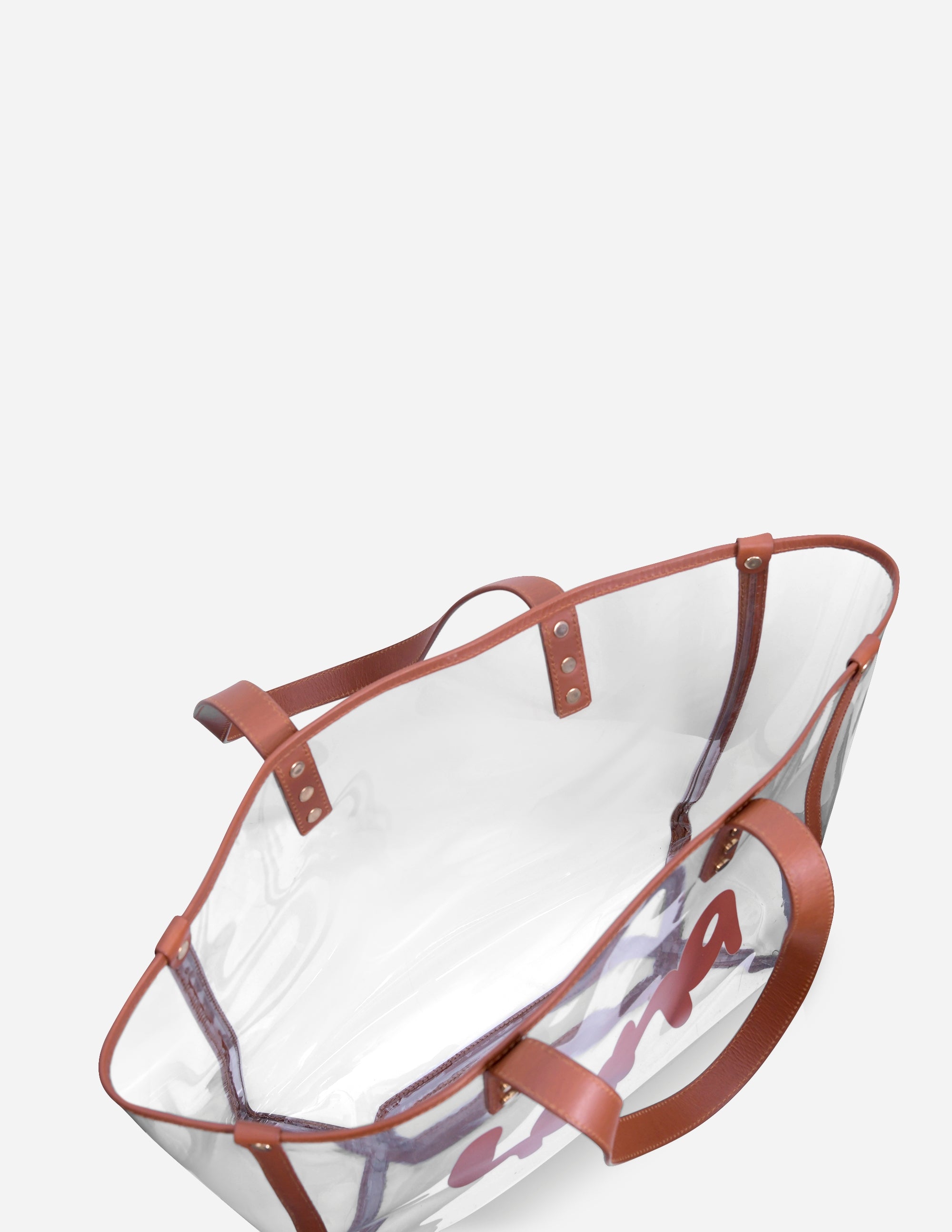 Leather clear tote bag with brown handles on a white background